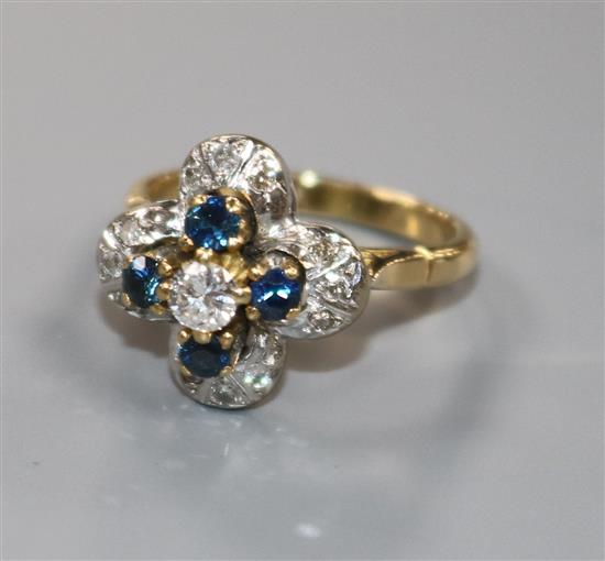 An 18ct gold, sapphire and diamond cluster flower head ring, size M.